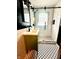 Bright, remodeled bathroom featuring a glass shower and a unique tile floor at 1309 N Colorado Ave, Indianapolis, IN 46201
