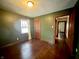Spacious bedroom featuring hardwood floors, neutral walls, and natural light at 1309 N Colorado Ave, Indianapolis, IN 46201