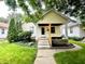Charming single-Gathering home with a welcoming front porch and well-maintained landscaping at 1309 N Colorado Ave, Indianapolis, IN 46201
