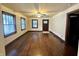 Living room showcasing original hardwood floors and vintage window and door trim at 1309 N Colorado Ave, Indianapolis, IN 46201