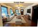 Staged living room featuring ample lighting, stylish décor, and hardwood floors at 1309 N Colorado Ave, Indianapolis, IN 46201