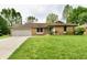 Charming brick ranch home with attached garage and a well-maintained lawn at 135 Hickory Ct, Greenwood, IN 46142