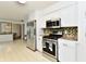 Modern kitchen with stainless steel appliances and a view to the dining area at 135 Hickory Ct, Greenwood, IN 46142