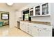 Well-lit kitchen featuring white cabinets, stainless steel dishwasher, and modern fixtures at 135 Hickory Ct, Greenwood, IN 46142