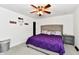 Cozy main bedroom featuring neutral carpet, ceiling fan, and a gray night stand at 135 Hickory Ct, Greenwood, IN 46142