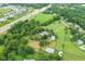 Spacious acreage featuring a meticulously kept home, large outbuildings, pond, and road access for easy commutes at 14655 Little Eagle Creek Ave, Zionsville, IN 46077
