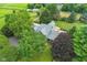 An aerial perspective showcases a home, surrounded by lush trees and well-maintained landscaping at 14655 Little Eagle Creek Ave, Zionsville, IN 46077