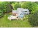 Charming home from above with a large, landscaped backyard featuring a patio and lush greenery at 14655 Little Eagle Creek Ave, Zionsville, IN 46077