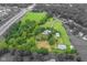 Beautiful property featuring manicured lawn, mature trees, outbuildings, pond and a well maintained home at 14655 Little Eagle Creek Ave, Zionsville, IN 46077