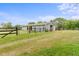 Spacious barn with fencing, ample room for animals, and lush greenery at 14655 Little Eagle Creek Ave, Zionsville, IN 46077