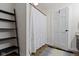 A cozy bathroom featuring a shower with decorative curtain, and dark wood vinyl flooring at 14655 Little Eagle Creek Ave, Zionsville, IN 46077