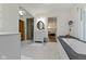 Bright bathroom with vanity, tub, and access to the main bedroom at 14655 Little Eagle Creek Ave, Zionsville, IN 46077