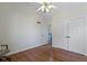 Bedroom with hardwood floors featuring a chair and closet doors at 14655 Little Eagle Creek Ave, Zionsville, IN 46077