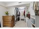 Walk-in closet with dresser and organized storage for clothes and accessories at 14655 Little Eagle Creek Ave, Zionsville, IN 46077