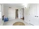 Inviting hallway with white wainscoting, doorways, and natural light at 14655 Little Eagle Creek Ave, Zionsville, IN 46077
