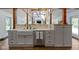 Modern kitchen with stainless steel appliances, island and hardwood floors at 14655 Little Eagle Creek Ave, Zionsville, IN 46077