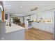 Updated kitchen open to the dining area with stainless steel appliances and hardwood floors at 14655 Little Eagle Creek Ave, Zionsville, IN 46077