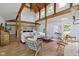 Bright living room with hardwood floors, vaulted ceilings, exposed beams and open floor plan at 14655 Little Eagle Creek Ave, Zionsville, IN 46077