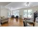 Spacious living room with hardwood floors and large windows at 14655 Little Eagle Creek Ave, Zionsville, IN 46077