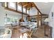 Spacious living room with hardwood floors, wood beam vaulted ceiling, and open floor plan at 14655 Little Eagle Creek Ave, Zionsville, IN 46077