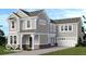 Charming two-story home with a welcoming porch and attached two-car garage, set against a blue sky at 16055 Meadow Frost Ct, Fishers, IN 46037