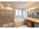 This bathroom features a walk-in shower, soaking tub, and a double window for natural light at 16156 Oliver St, Fishers, IN 46037