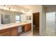 Bathroom featuring double sinks, a toilet room and walk-in closet for ample storage space at 16156 Oliver St, Fishers, IN 46037