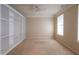 Neutral bedroom featuring built-in shelving, plush carpeting, and ample natural light at 16156 Oliver St, Fishers, IN 46037