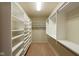 Walk-in closet with shelving for organized storage, and neutral carpeting at 16156 Oliver St, Fishers, IN 46037