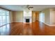 Inviting living room with a fireplace, hardwood floors, and natural light at 16156 Oliver St, Fishers, IN 46037