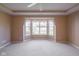 Sun-filled bedroom featuring a bay window and neutral decor for a serene retreat at 16156 Oliver St, Fishers, IN 46037
