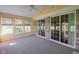 Inviting sunroom with ample natural light, featuring carpet flooring, and neutral paint at 16156 Oliver St, Fishers, IN 46037