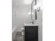 Stylish bathroom vanity with modern lighting, providing a fresh and well-lit space at 1630 N Granville N Ave, Muncie, IN 47303