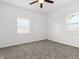 Bright room with carpet and two windows, providing a clean and simple design at 1630 N Granville N Ave, Muncie, IN 47303