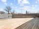 Spacious outdoor deck featuring wood flooring, offering ample space for outdoor furniture and entertaining at 1630 N Granville N Ave, Muncie, IN 47303