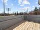 Spacious outdoor deck featuring wood flooring, offering ample space for outdoor furniture and entertaining at 1630 N Granville N Ave, Muncie, IN 47303