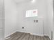 Clean and functional laundry room with ample space and natural light at 1630 N Granville N Ave, Muncie, IN 47303