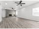 Bright and open living area features a charming brick fireplace at 1630 N Granville N Ave, Muncie, IN 47303