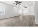 Spacious living room with ample natural light and ceiling fans at 1630 N Granville N Ave, Muncie, IN 47303