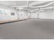Spacious commercial interior featuring painted concrete floors, bright white walls, and industrial lighting at 1630 N Granville N Ave, Muncie, IN 47303