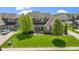 Aerial view of the two-story home, highlighting its manicured lawn and residential surroundings at 16305 Kenora N Ln, Fortville, IN 46040