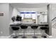 Finished basement has a bar with stone countertop, bar seating and a kitchenette at 16305 Kenora N Ln, Fortville, IN 46040