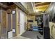 Basement home gym with exercise equipment, rubber flooring, and exposed ceiling at 16305 Kenora N Ln, Fortville, IN 46040