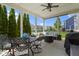 Spacious covered patio with dining and seating areas, perfect for outdoor entertaining at 16305 Kenora N Ln, Fortville, IN 46040