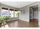 Open dining area with natural light, neutral paint, and views of the community at 16305 Kenora N Ln, Fortville, IN 46040