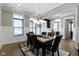 Bright dining area with a stylish chandelier, views to the office and modern decor at 16305 Kenora N Ln, Fortville, IN 46040