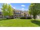 Charming two-story brick home featuring a well-manicured lawn, inviting front porch and beautiful landscaping at 16305 Kenora N Ln, Fortville, IN 46040
