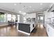 Spacious kitchen features a large island with granite countertops, stainless steel appliances, and an adjacent dining area at 16305 Kenora N Ln, Fortville, IN 46040