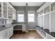 Functional mudroom offering ample storage with lockers, cabinets, and a convenient desk area at 16305 Kenora N Ln, Fortville, IN 46040
