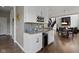 Close up of wet bar with white cabinetry, a wine rack and a beverage cooler at 16305 Kenora N Ln, Fortville, IN 46040